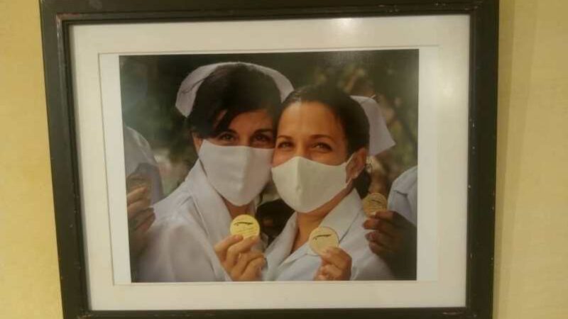 Photographs featuring women’s faces grace the lobby of the National Theatre of Cuba