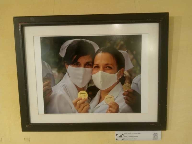 Photographs featuring women’s faces grace the lobby of the National Theatre of Cuba